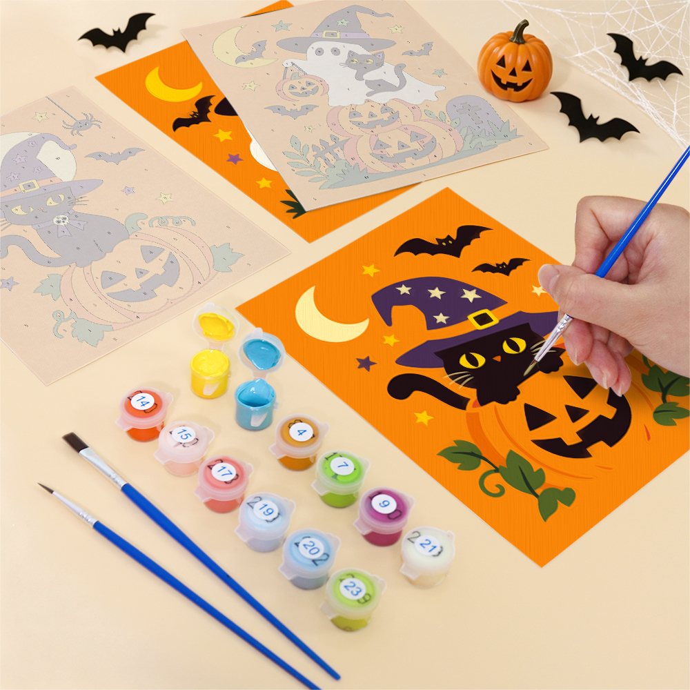 Filling in a Ghosts in Witch Hats mini canvas with numbered acrylic paints and a fine brush