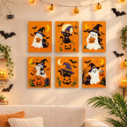 Six finished Ghosts in Witch Hats mini paintings hung on a wall above a table