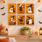 Ghosts in Witch Hats mini paintings displayed as a gallery wall in a sunny kitchen