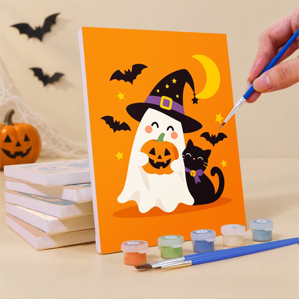 Painting a Ghosts in Witch Hats mini canvas propped up beside numbered acrylic paints