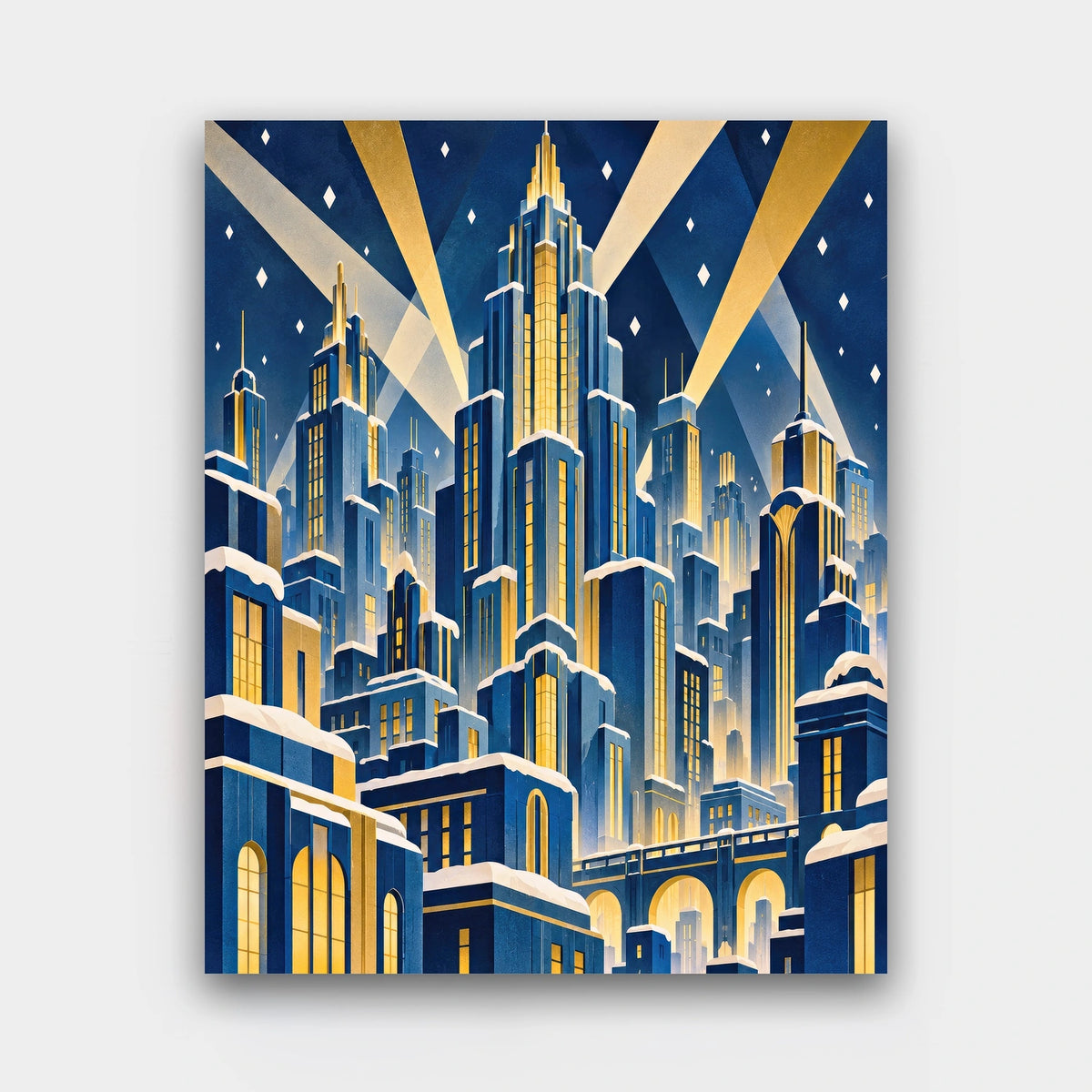 Gilded Winter Skyline paint by numbers kit of an Art Deco city skyline of stepped towers and searchlights in navy and gold with falling snow