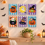 Gingham Halloween mini paintings displayed as a gallery wall in a sunny kitchen