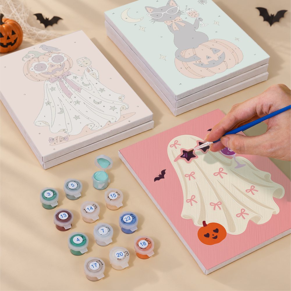 Numbered paint pots and brushes on a pre-stretched Glam Ghouls mini canvas