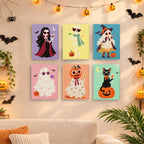 Painting a Glam Ghouls mini canvas propped up beside numbered acrylic paints