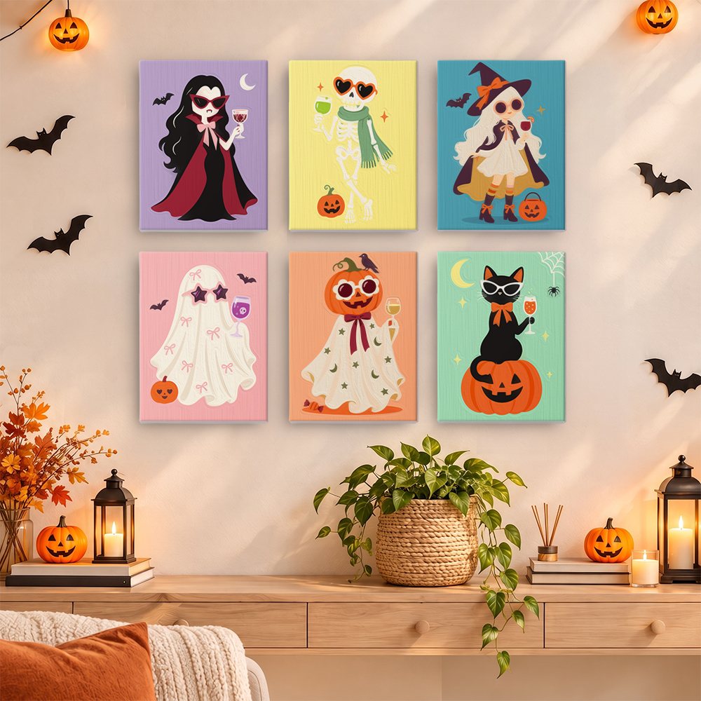 Painting one of the Glam Ghouls designs next to a stack of mini canvases