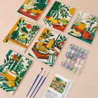 Golden Hour Tables mini paint by numbers kit with six numbered canvases, acrylic paints, brushes and layout