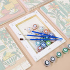 Numbered paint pots and brushes on a pre-stretched Golden Hour Tables mini canvas