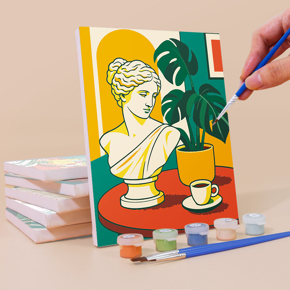 Painting a Golden Hour Tables mini canvas propped up beside numbered acrylic paints