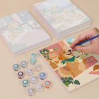 Painting one of the Golden Retriever Days designs next to a stack of mini canvases