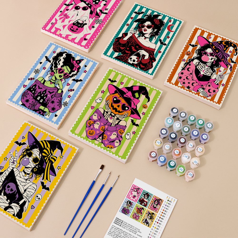 Painting one of the Gothic Glam Girls designs next to a stack of mini canvases