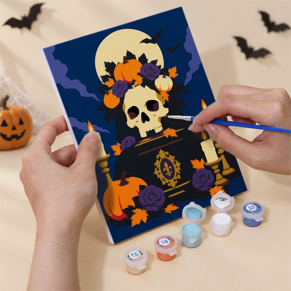 Hand holding a Gothic Graveyard Night mini canvas while painting the details