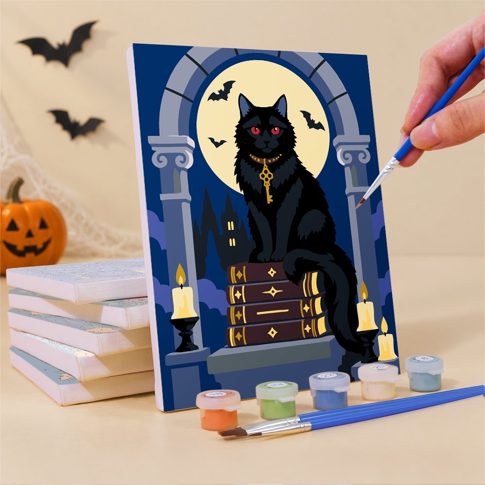 Painting a Gothic Graveyard Night mini canvas propped up beside numbered acrylic paints
