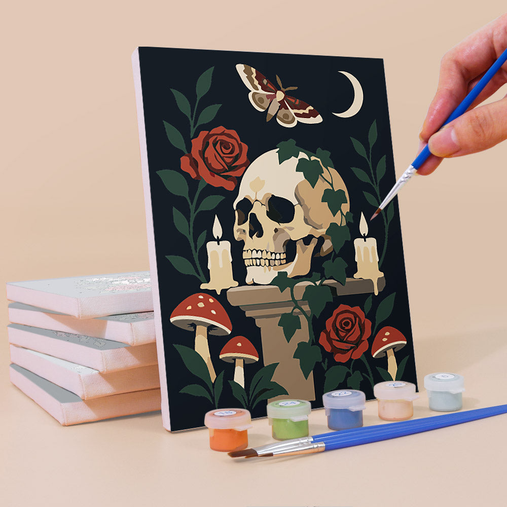 Painting a Gothic Still Life mini canvas propped up beside numbered acrylic paints