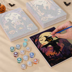 Painting one of the Gothic Twilight Tales designs next to a stack of mini canvases