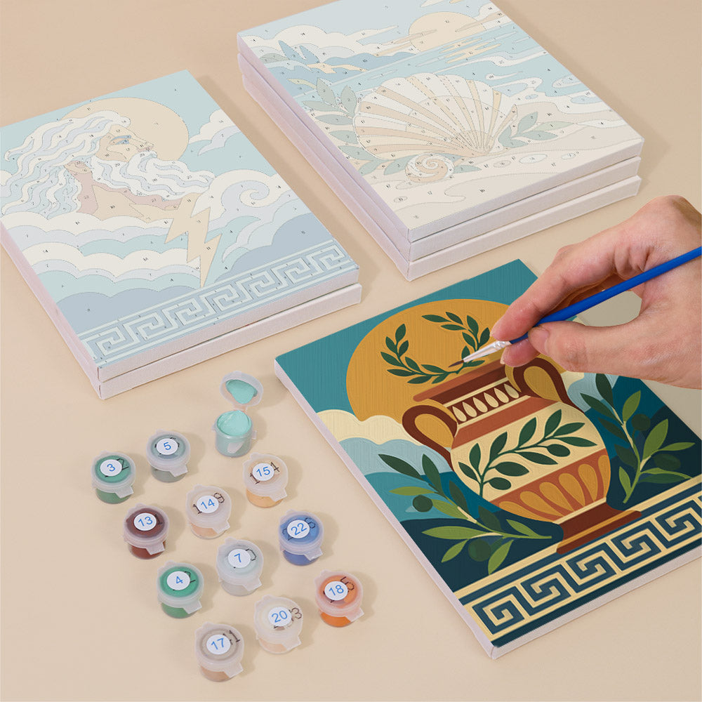 Painting one of the Greek Myths designs next to a stack of mini canvases