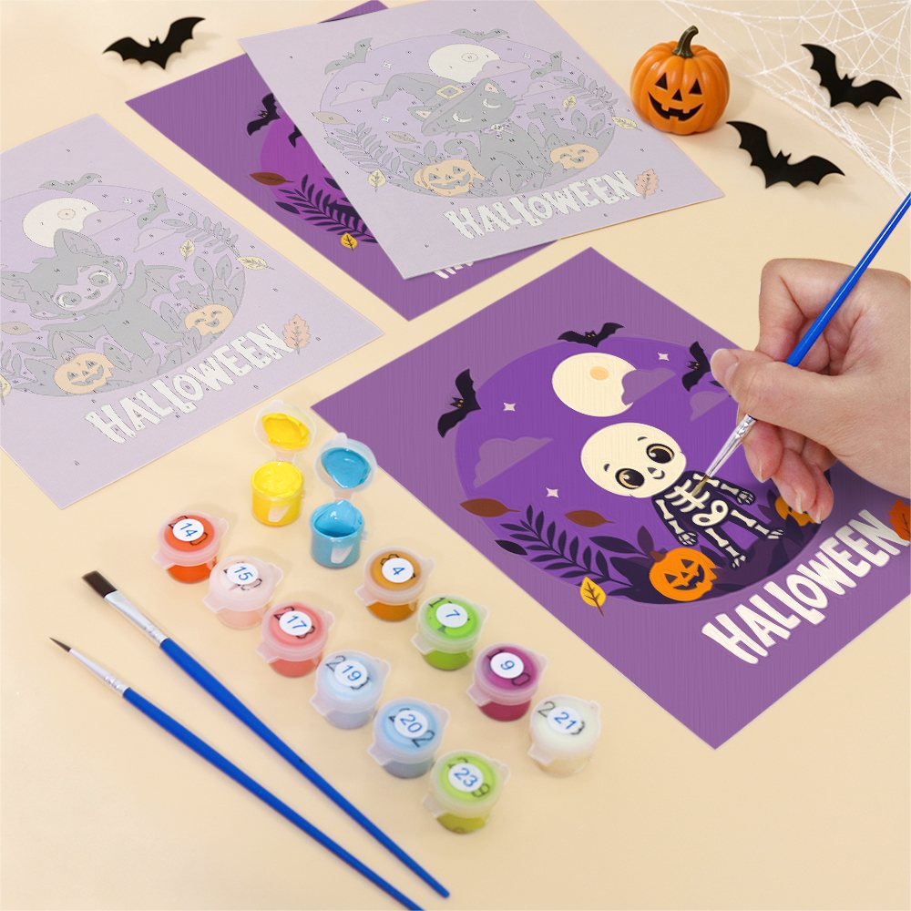 Filling in a Halloween Banner Friends mini canvas with numbered acrylic paints and a fine brush