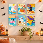 Painting a Halloween Beach Vacation mini canvas propped up beside numbered acrylic paints