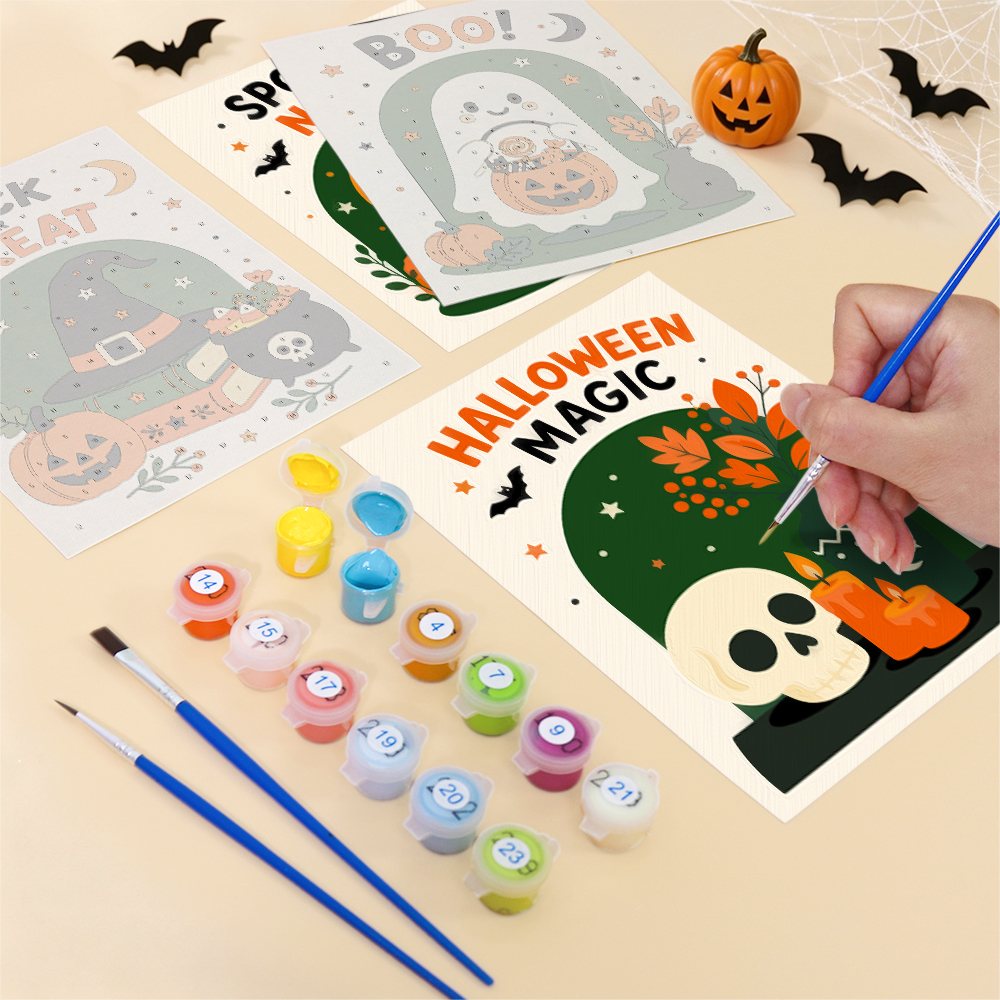 Filling in a Halloween Greetings mini canvas with numbered acrylic paints and a fine brush