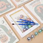 Numbered paint pots and brushes on a pre-stretched Halloween Greetings mini canvas