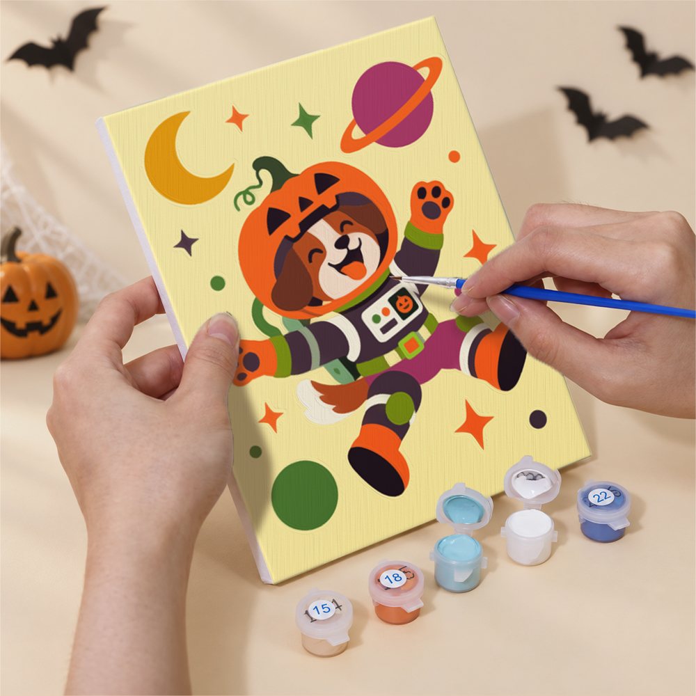 Hand holding a Halloween Hangout Friends mini canvas while painting the details