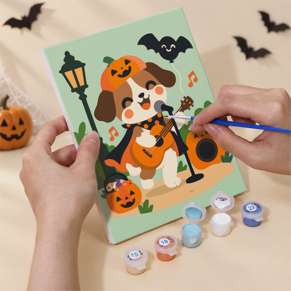 Hand holding a Halloween Jam Session mini canvas while painting the details