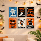 Six finished Halloween Party Signs mini paintings hung on a wall above a table
