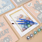 Numbered paint pots and brushes on a pre-stretched Halloween Party Signs mini canvas