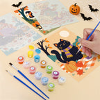 Filling in a Halloween Picnic Party mini canvas with numbered acrylic paints and a fine brush