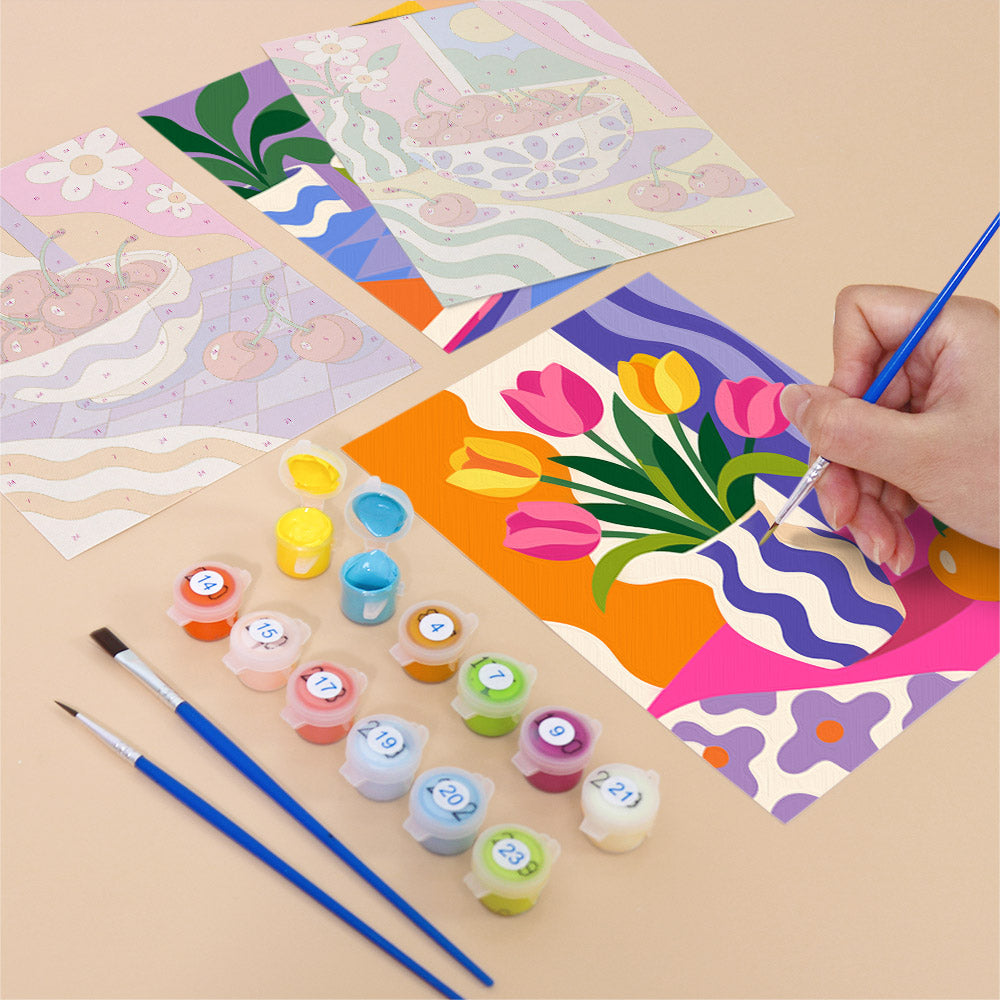 Filling in a Happy Hues mini canvas with numbered acrylic paints and a fine brush