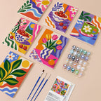 Happy Hues mini paint by numbers kit with six numbered canvases, acrylic paints, brushes and layout