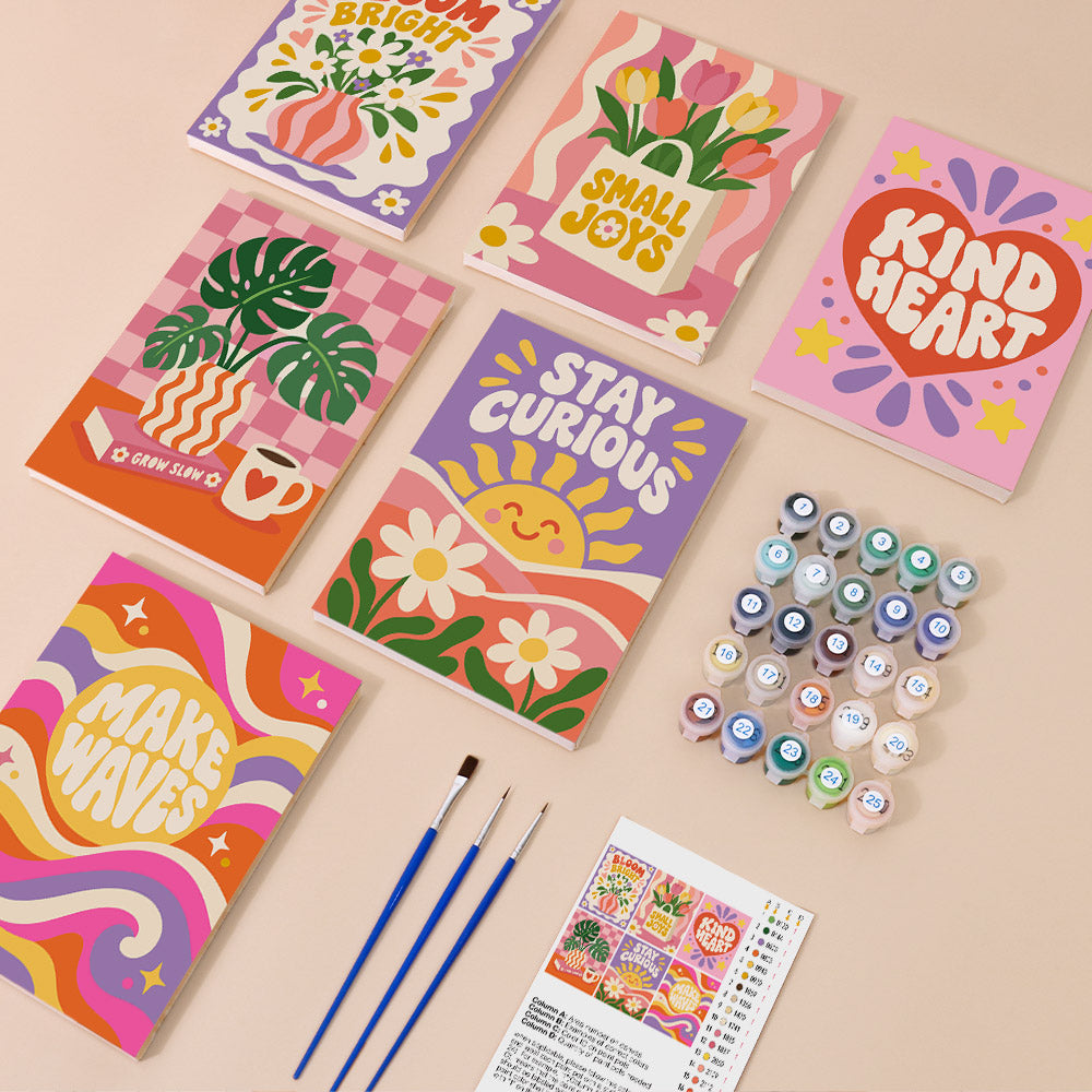 Happy Words mini paint by numbers kit with six numbered canvases, acrylic paints, brushes and layout