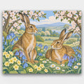 Hares in the Bluebells paint by numbers kit of two brown hares among bluebells, primroses and daisies under blossoming trees