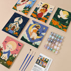 Painting one of the Harvest Blessings designs next to a stack of mini canvases