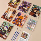 Painting one of the Haunted Cafe Crew designs next to a stack of mini canvases