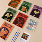 Haunted Happy Hour mini paint by numbers kit with six numbered canvases, acrylic paints, brushes and layout