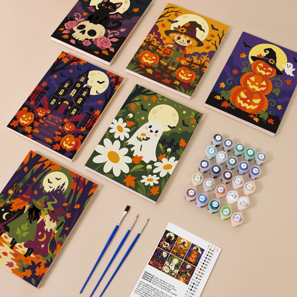 Painting one of the Haunted Harvest Nights designs next to a stack of mini canvases