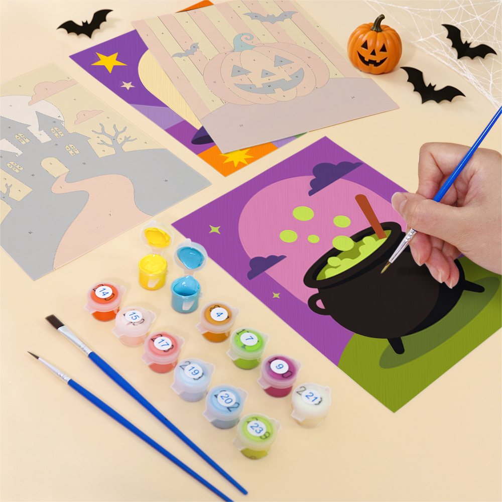Filling in a Haunted Night Icons mini canvas with numbered acrylic paints and a fine brush