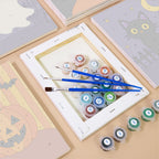 Numbered paint pots and brushes on a pre-stretched Haunted Night Icons mini canvas