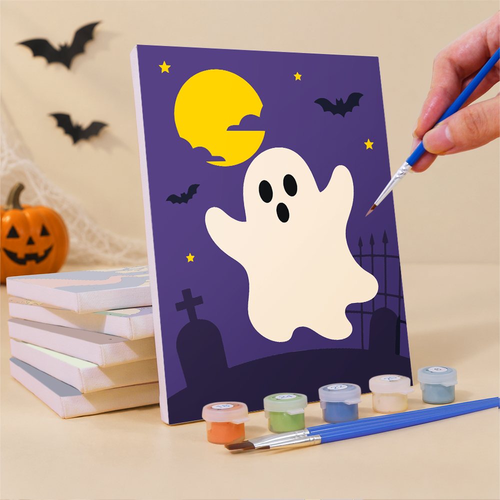 Painting a Haunted Night Icons mini canvas propped up beside numbered acrylic paints
