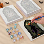 Painting one of the Haunted Portraits designs next to a stack of mini canvases