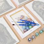 Numbered paint pots and brushes on a pre-stretched Haunted Portraits mini canvas