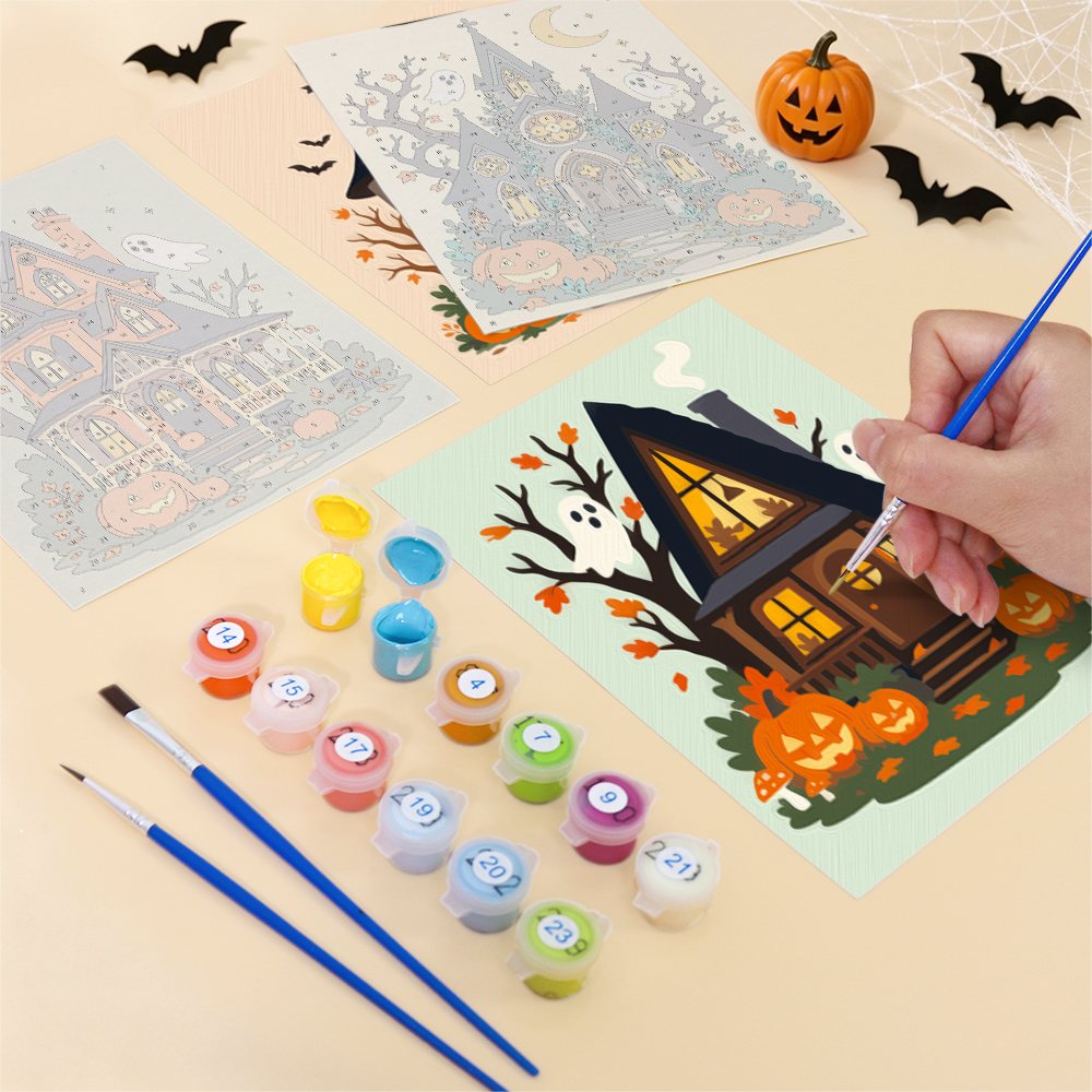 Filling in a Haunted Pumpkin Cottages mini canvas with numbered acrylic paints and a fine brush