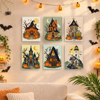 Six finished Haunted Pumpkin Cottages mini paintings hung on a wall above a table