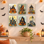 Haunted Pumpkin Cottages mini paintings displayed as a gallery wall in a sunny kitchen