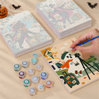Painting one of the Haunted World Travelers designs next to a stack of mini canvases