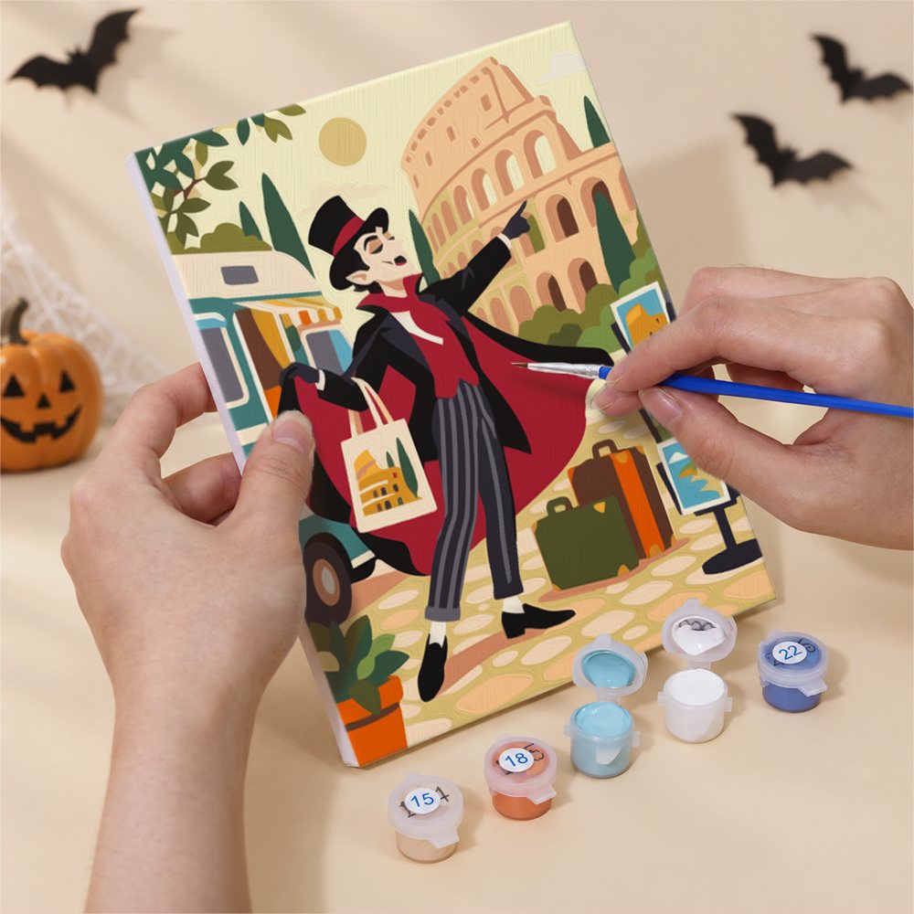 Hand holding a Haunted World Travelers mini canvas while painting the details