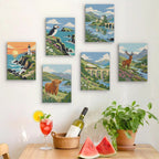 Six finished Highland Journey mini paintings hung on a wall above a table