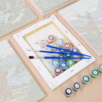 Numbered paint pots and brushes on a pre-stretched Highland Journey mini canvas