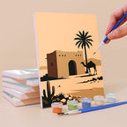 Painting a Homes Around the World mini canvas propped up beside numbered acrylic paints
