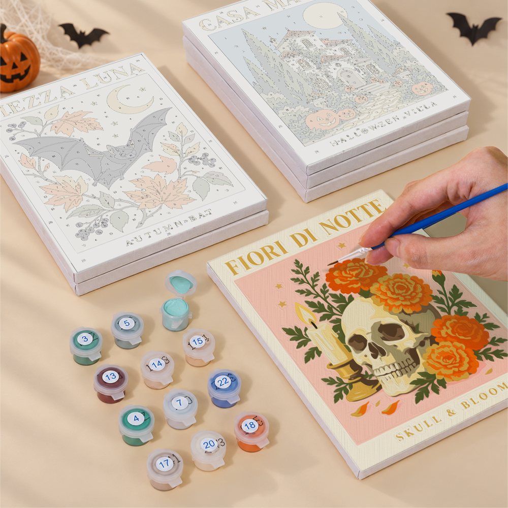 Painting one of the Italian Halloween Botanicals designs next to a stack of mini canvases
